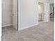 Bright bedroom with carpet and white trim with doors leading to bath and closet at 125 Bold Dr, Youngsville, NC 27596