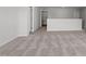 Hallway with neutral paint and carpet and bright white trim gives a spacious feel to the home at 125 Bold Dr, Youngsville, NC 27596