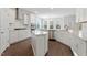 Spacious kitchen with white cabinets, stainless steel appliances, a central island, and abundant natural light at 125 Bold Dr, Youngsville, NC 27596
