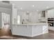 Bright open kitchen with a large island, stainless steel appliances, and ample counter space for cooking and entertaining at 125 Bold Dr, Youngsville, NC 27596