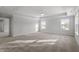 Large main bedroom with tray ceiling, neutral carpet and bright natural light at 125 Bold Dr, Youngsville, NC 27596