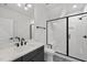 Stylish bathroom features modern fixtures, a black-framed glass shower, and sleek design at 4800 Lakemont Dr, Raleigh, NC 27609