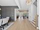 Spacious dining room leading to open-concept living area with hardwood floors and stylish lighting at 4800 Lakemont Dr, Raleigh, NC 27609
