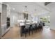 A modern kitchen boasts a large island, stainless appliances, and open dining room at 4800 Lakemont Dr, Raleigh, NC 27609