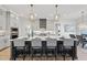 A modern kitchen boasts a large island, stainless appliances, and stylish pendant lighting at 4800 Lakemont Dr, Raleigh, NC 27609
