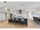 A modern kitchen boasts a large island, stainless appliances, and stylish pendant lighting at 4800 Lakemont Dr, Raleigh, NC 27609