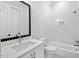 Modern bathroom with white tile, bathtub, and updated fixtures at 114 Sanderway Dr, Chapel Hill, NC 27516