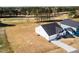 This is an aerial view of the home and golf course near a wooded area at 818 Barbour Farm Ln, Four Oaks, NC 27524