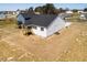 This is an aerial view of a white home with a screened porch at 818 Barbour Farm Ln, Four Oaks, NC 27524