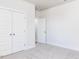 Bedroom view highlighting closet and entry doors, neutral carpet and neutral color at 818 Barbour Farm Ln, Four Oaks, NC 27524