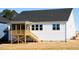 Back of home featuring screened in porch with stairs to the yard at 818 Barbour Farm Ln, Four Oaks, NC 27524