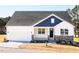 Charming single-Gathering home featuring a two-car garage and a welcoming front porch with stone accents at 818 Barbour Farm Ln, Four Oaks, NC 27524