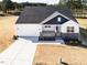 This is an aerial view of a white home and long driveway at 818 Barbour Farm Ln, Four Oaks, NC 27524