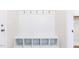 Bright mudroom features white shelving, cubbies, and hooks for storage and organization at 818 Barbour Farm Ln, Four Oaks, NC 27524