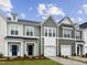 Charming townhomes boast eye-catching exteriors and well-manicured front yards in a vibrant community at 39 Pansy Park # 232, Clayton, NC 27520