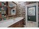 Stylish bathroom with a unique book wallpaper and a vanity at 7220 Dime Dr, Raleigh, NC 27606