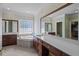 Elegant bathroom with double vanities and a soaking tub at 7220 Dime Dr, Raleigh, NC 27606