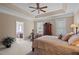 Spacious bedroom with a king-size bed, dresser, and ensuite bathroom at 7220 Dime Dr, Raleigh, NC 27606