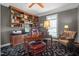 Home office with built-in shelves and comfortable chair at 7220 Dime Dr, Raleigh, NC 27606