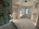 Unfinished bathroom with green moisture wrap and three light filled windows at 1101 Manchester, Raleigh, NC 27609