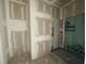 This bathroom displays the bare concrete floors, studs, and in-shower tile at 1101 Manchester, Raleigh, NC 27609