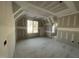 Unfinished bedroom featuring recessed lighting, dormer windows, and open doorway at 1101 Manchester, Raleigh, NC 27609