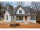 New construction home featuring a painted brick and gray facade, and a covered front porch at 1101 Manchester, Raleigh, NC 27609