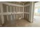 A future kitchen space is currently unfinished with exposed wiring and drywall at 1101 Manchester, Raleigh, NC 27609