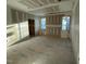 An unfinished living room featuring natural light from multiple windows and an open floor plan at 1101 Manchester, Raleigh, NC 27609