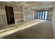 Large unfinished room with a sliding glass doors and an exposed support beam at 1101 Manchester, Raleigh, NC 27609