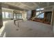Large unfinished living room featuring folding doors and a large staircase at 1101 Manchester, Raleigh, NC 27609