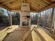 Covered outdoor patio under construction featuring a stone fireplace, ceiling, and natural view at 1101 Manchester, Raleigh, NC 27609