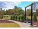 Park swings with walking path and mature trees enhance the serene outdoor space at 2812 Theresa Eileen Way, Raleigh, NC 27603