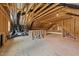 Unfinished attic space showcasing exposed wood framing, insulation, and mechanical systems at 2812 Theresa Eileen Way, Raleigh, NC 27603