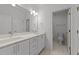 Bathroom featuring double sinks, modern fixtures, and a separate toilet room at 2812 Theresa Eileen Way, Raleigh, NC 27603