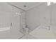 Stylish bathroom with a glass shower, white countertops, and patterned tile floors at 2812 Theresa Eileen Way, Raleigh, NC 27603