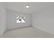Cozy bedroom with carpet, a large window, and a neutral color scheme at 2812 Theresa Eileen Way, Raleigh, NC 27603