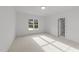 Bright bedroom featuring neutral walls, carpet and a window overlooking the yard at 2812 Theresa Eileen Way, Raleigh, NC 27603