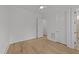 Empty bedroom features hardwood floors, neutral walls, and two doors at 2812 Theresa Eileen Way, Raleigh, NC 27603