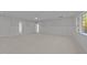 Spacious bonus room with board and batten detailing, white walls and carpet at 2812 Theresa Eileen Way, Raleigh, NC 27603