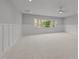 Expansive bonus room with board and batten and large windows overlooking the outdoors at 2812 Theresa Eileen Way, Raleigh, NC 27603