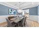 Elegant dining room featuring stylish decor, a modern chandelier, and large window at 2812 Theresa Eileen Way, Raleigh, NC 27603