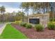 Entrance sign for Sanctuary at Lake Wheeler with manicured shrubbery at 2812 Theresa Eileen Way, Raleigh, NC 27603