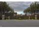 Community entrance featuring landscaped median and stone accents at 2812 Theresa Eileen Way, Raleigh, NC 27603