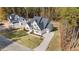 Beautiful new construction home with white exterior, dark roof, and well manicured yard at 2812 Theresa Eileen Way, Raleigh, NC 27603