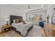 Tranquil main bedroom with tray ceiling, picture window, and stylish furnishings at 2812 Theresa Eileen Way, Raleigh, NC 27603