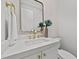 Elegant powder room with decorative vase, gold hardware and marble countertop at 2812 Theresa Eileen Way, Raleigh, NC 27603