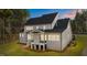 Aerial shot of the rear exterior of a well-lit home featuring windows and a covered porch at 2812 Theresa Eileen Way, Raleigh, NC 27603