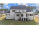 Spacious home's rear exterior features large windows and a screened porch at 2812 Theresa Eileen Way, Raleigh, NC 27603
