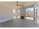 Covered porch featuring a ceiling fan, fireplace, and views of the backyard at 2812 Theresa Eileen Way, Raleigh, NC 27603